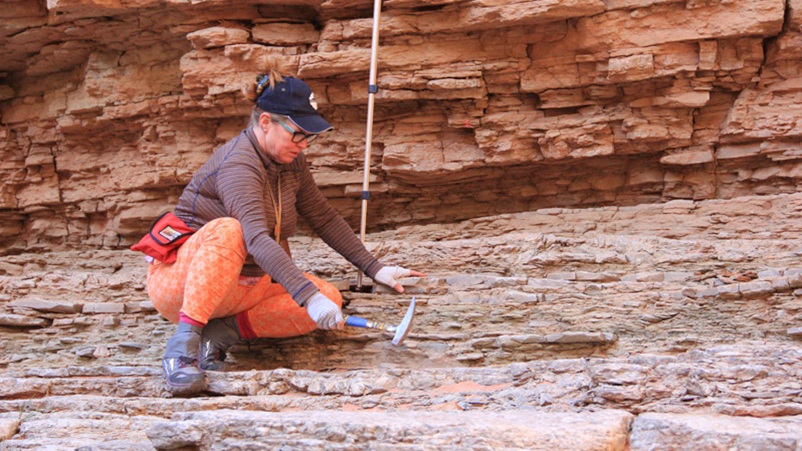 Geologist using a rock hammer in the Grand Canyon.