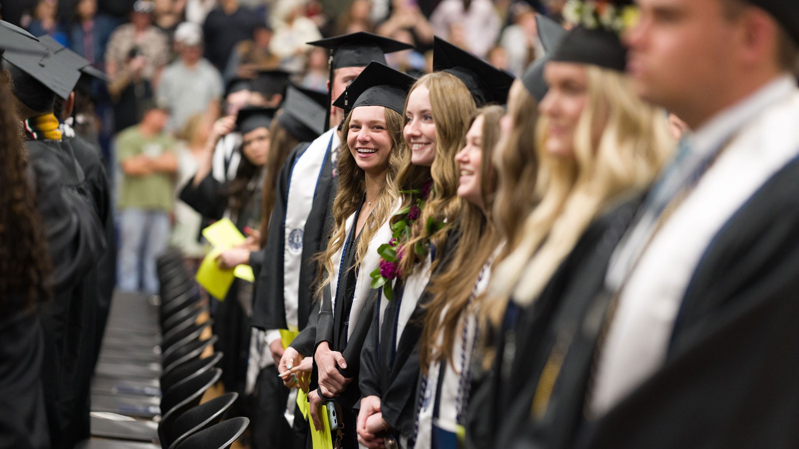 Students in graduation robes.