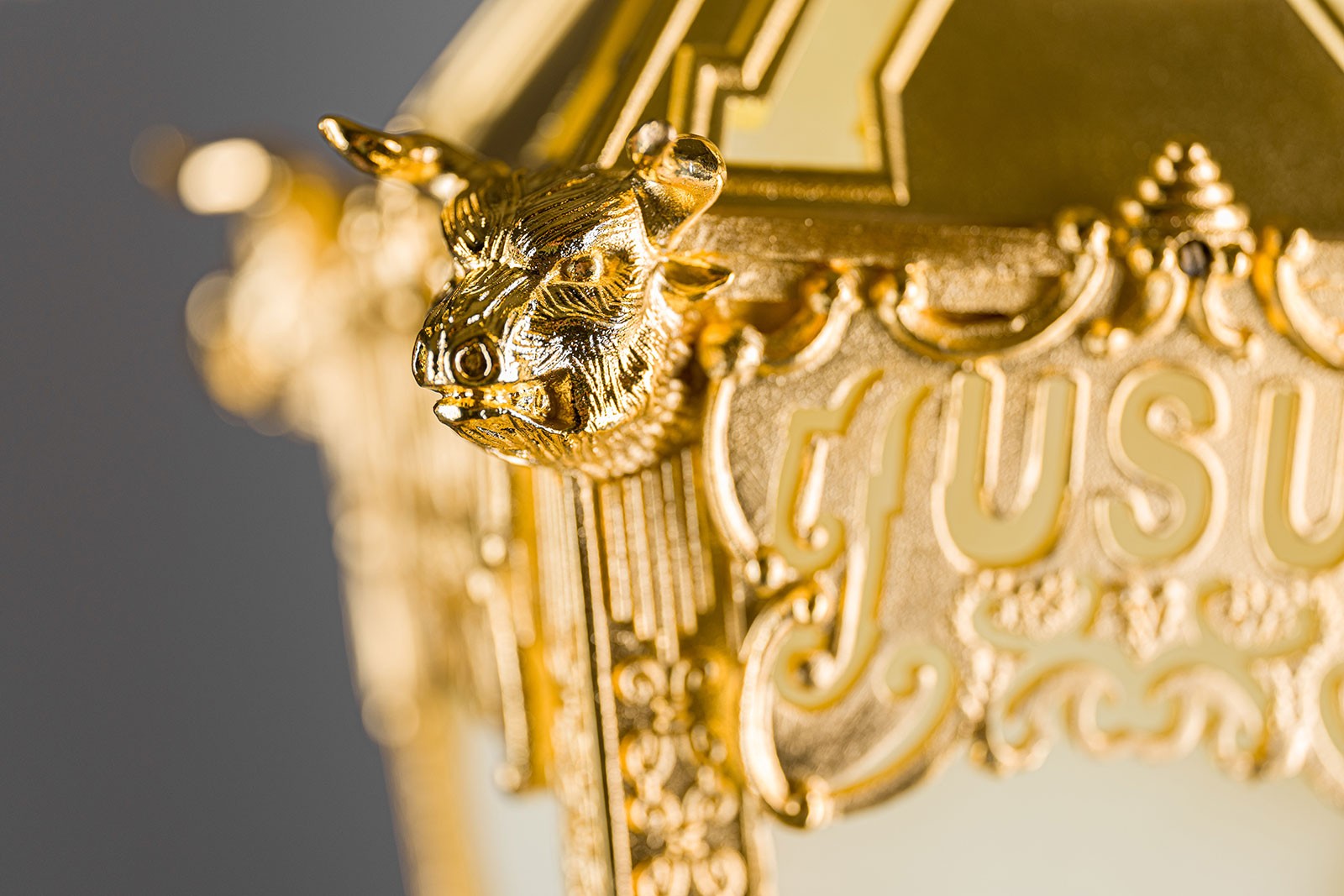 A closeup of the golden bulls and beehives on USU's new ceremonial mace.