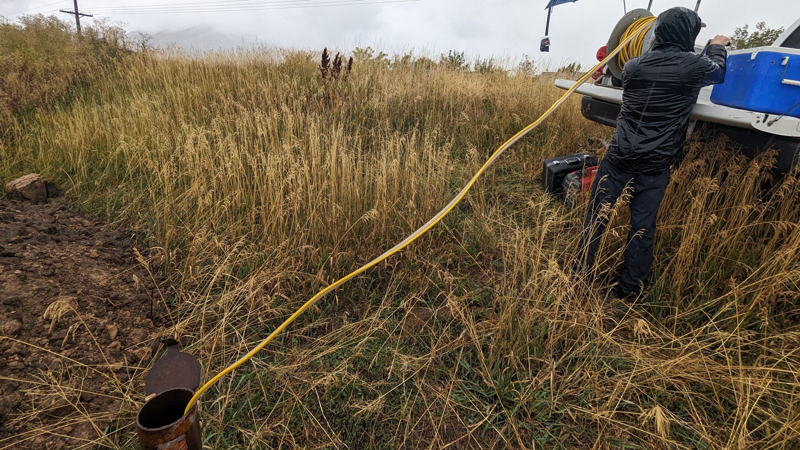 A worker collecting groundwater samples.