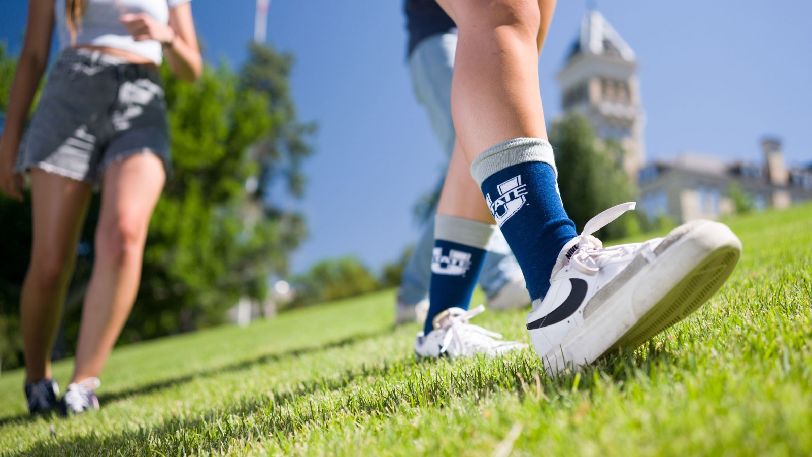 People walking on Old Main Hill in Logan.