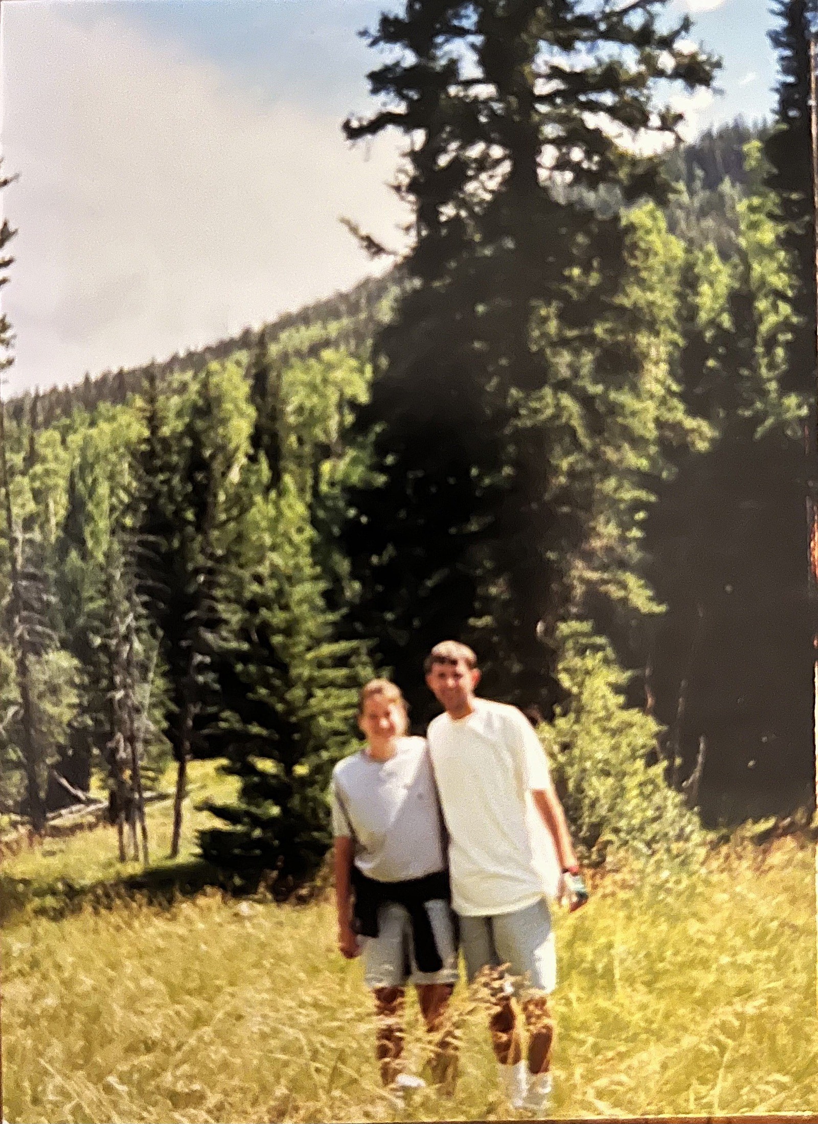 Jeff and Jackie Davis standing in a forest.