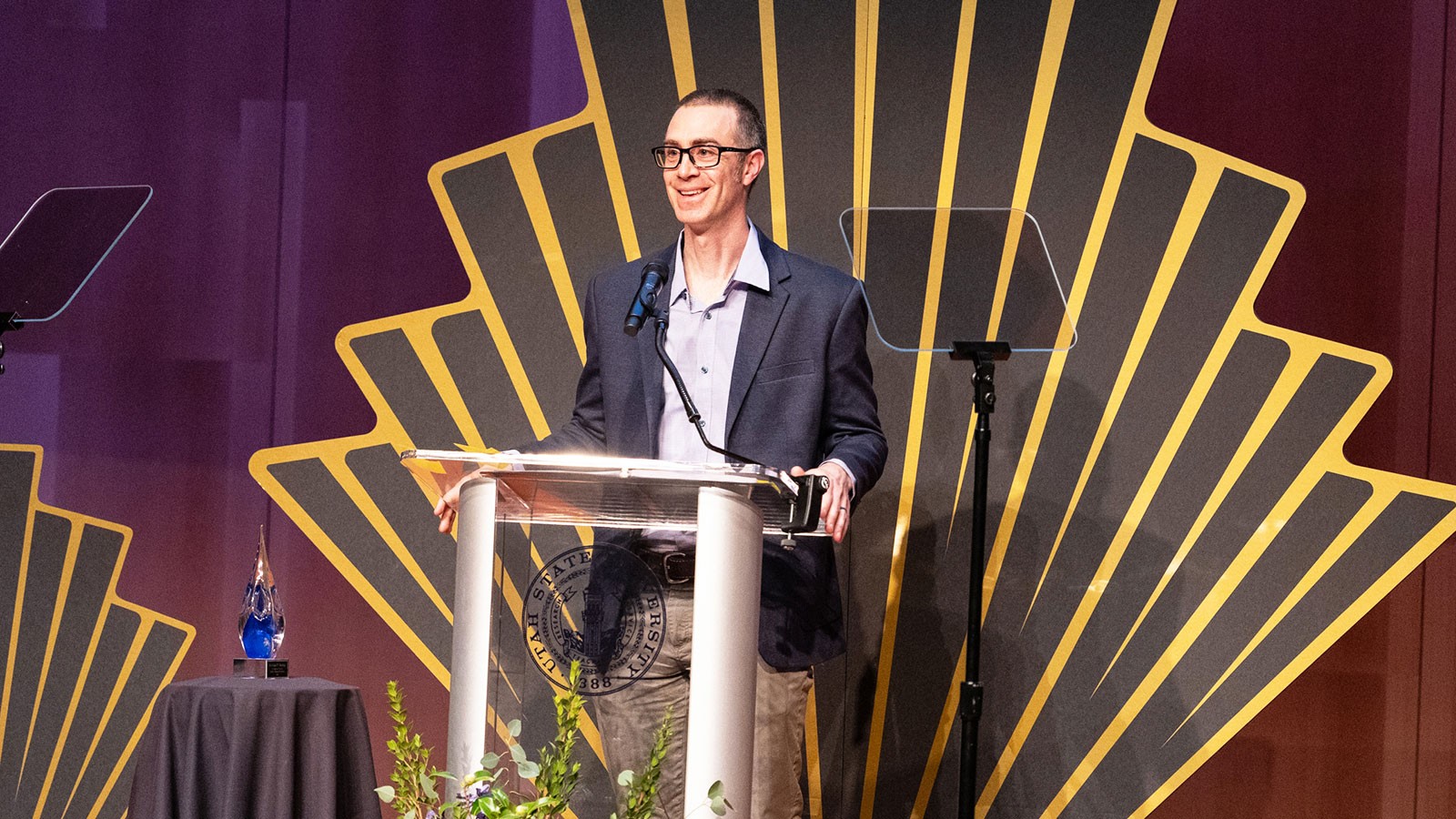 Michael Twohig speaking at an awards ceremony.