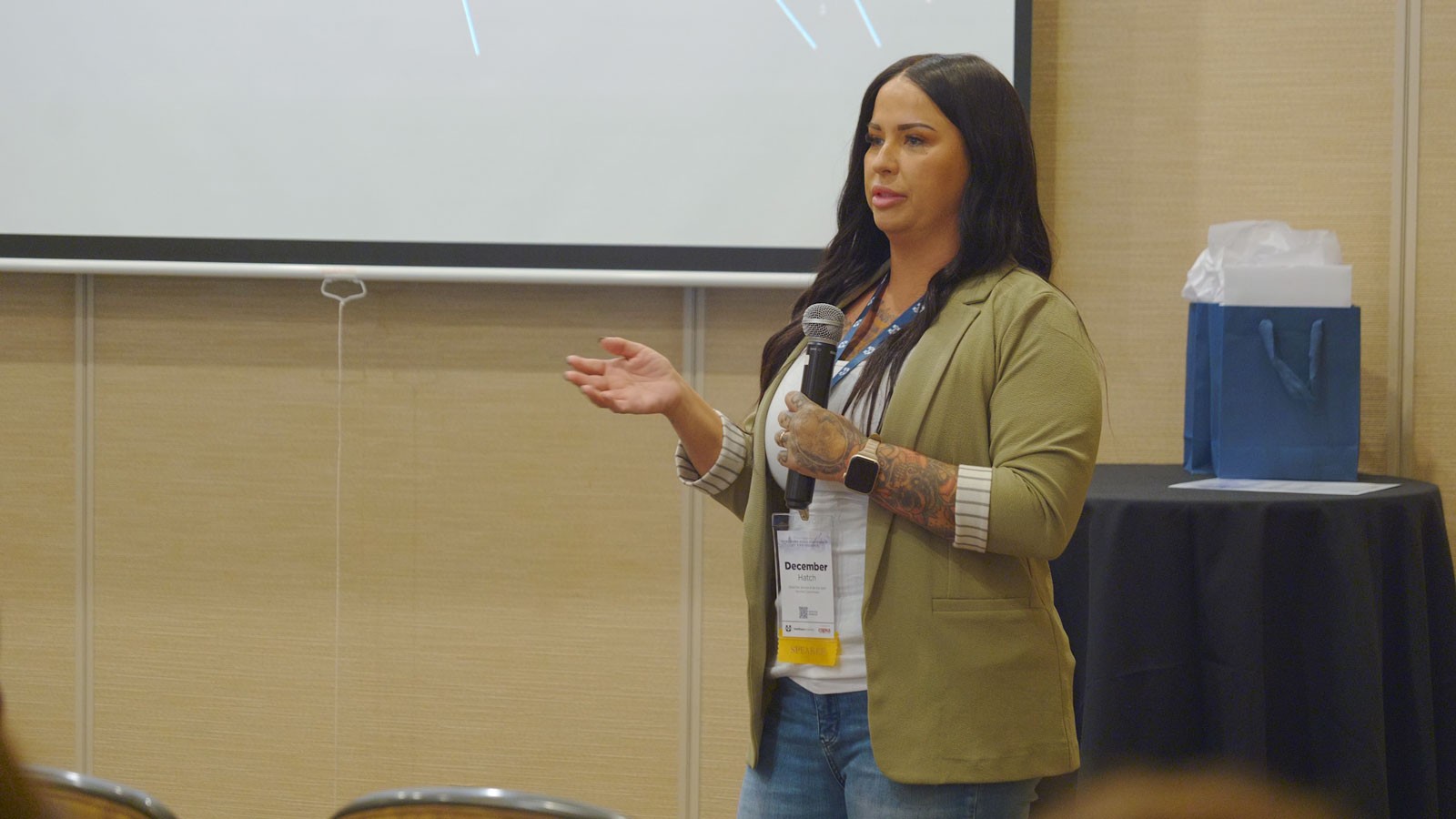 A person speaking at a conference.