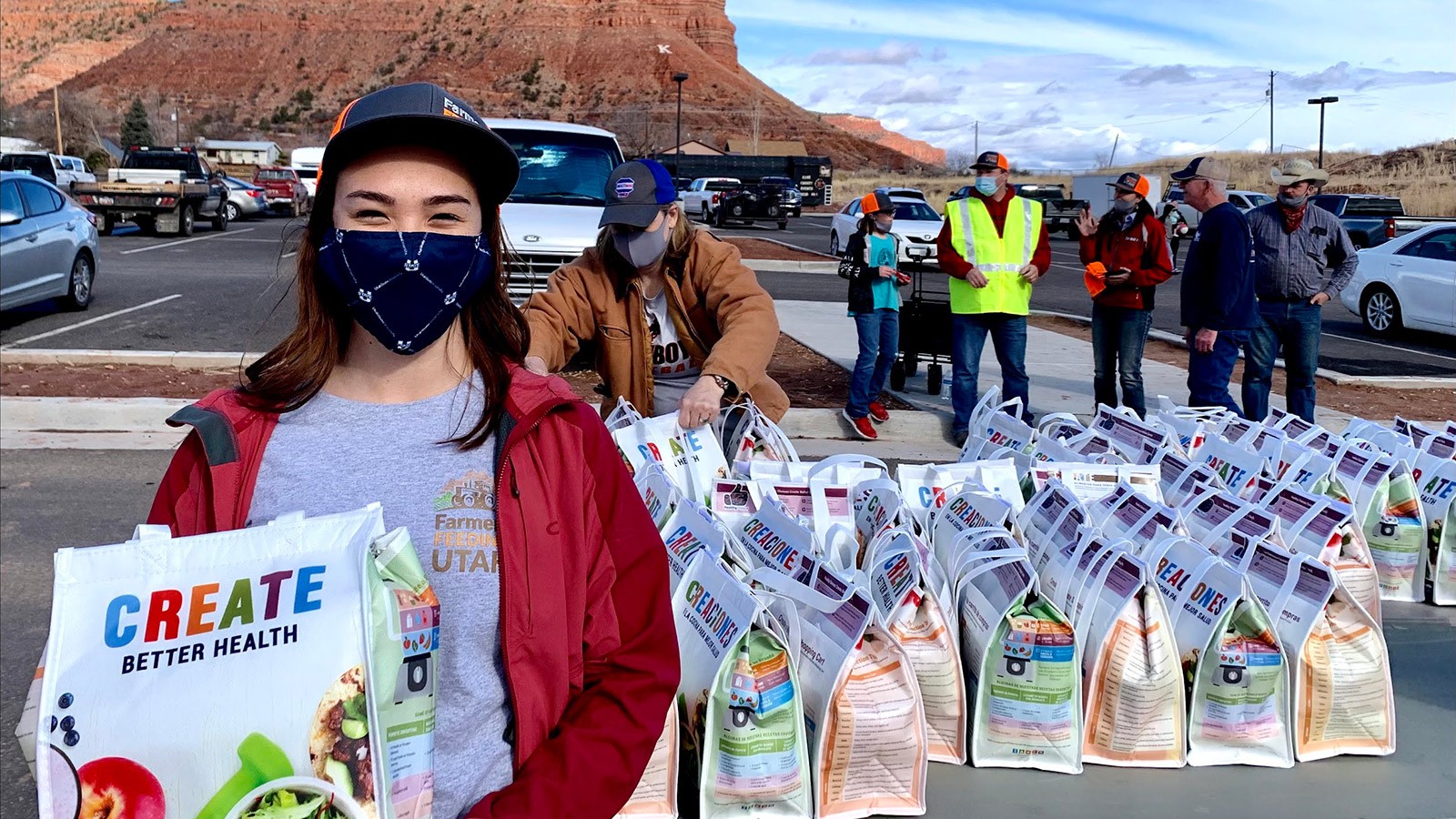 Amria Farnsworth distributing food last year at a Farmers Feeding Utah event in Southern Utah.