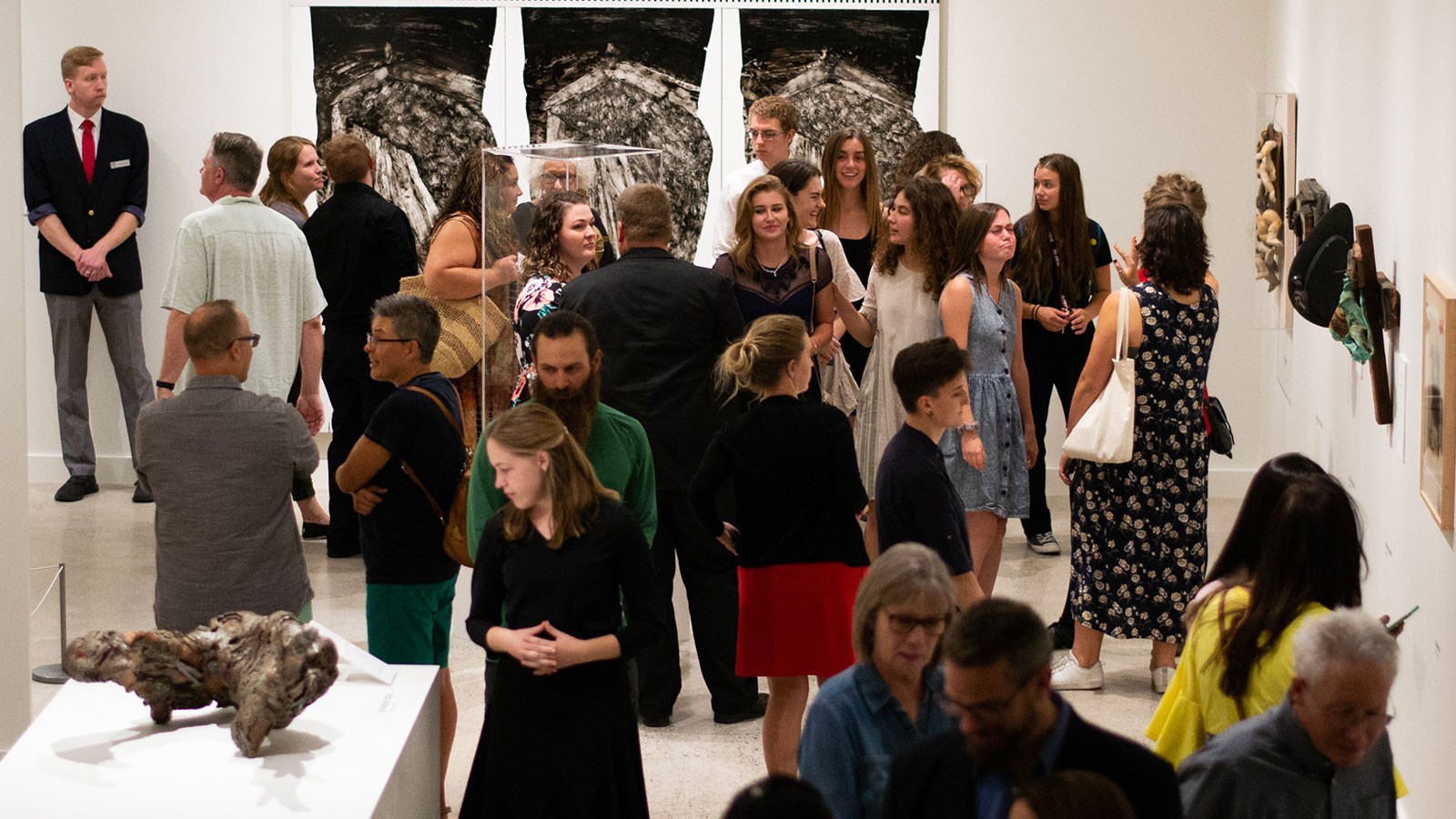 Patrons view exhibits at the Nora Eccles Harrison Museum of Art at Utah State University.