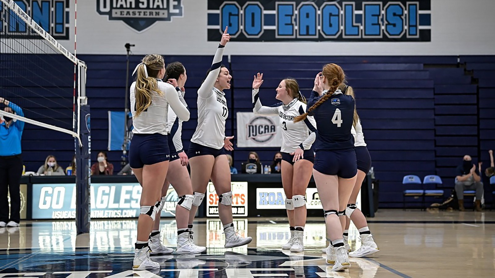USU Eastern volleyball celebrates after a point is scored.