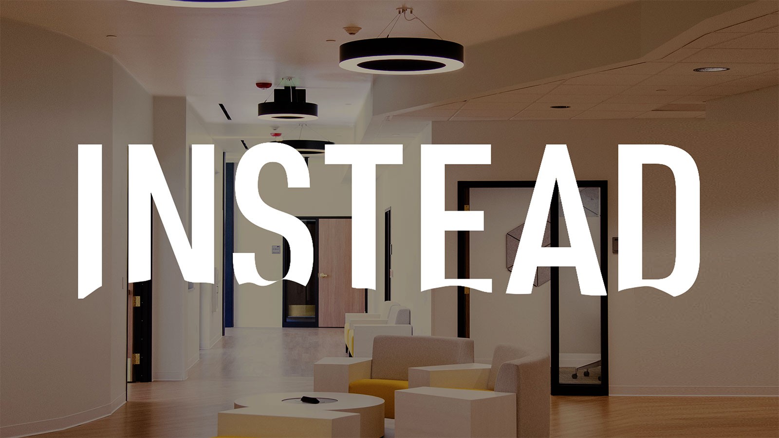 The Instead podcast logo is imposed over a building's lounge area.