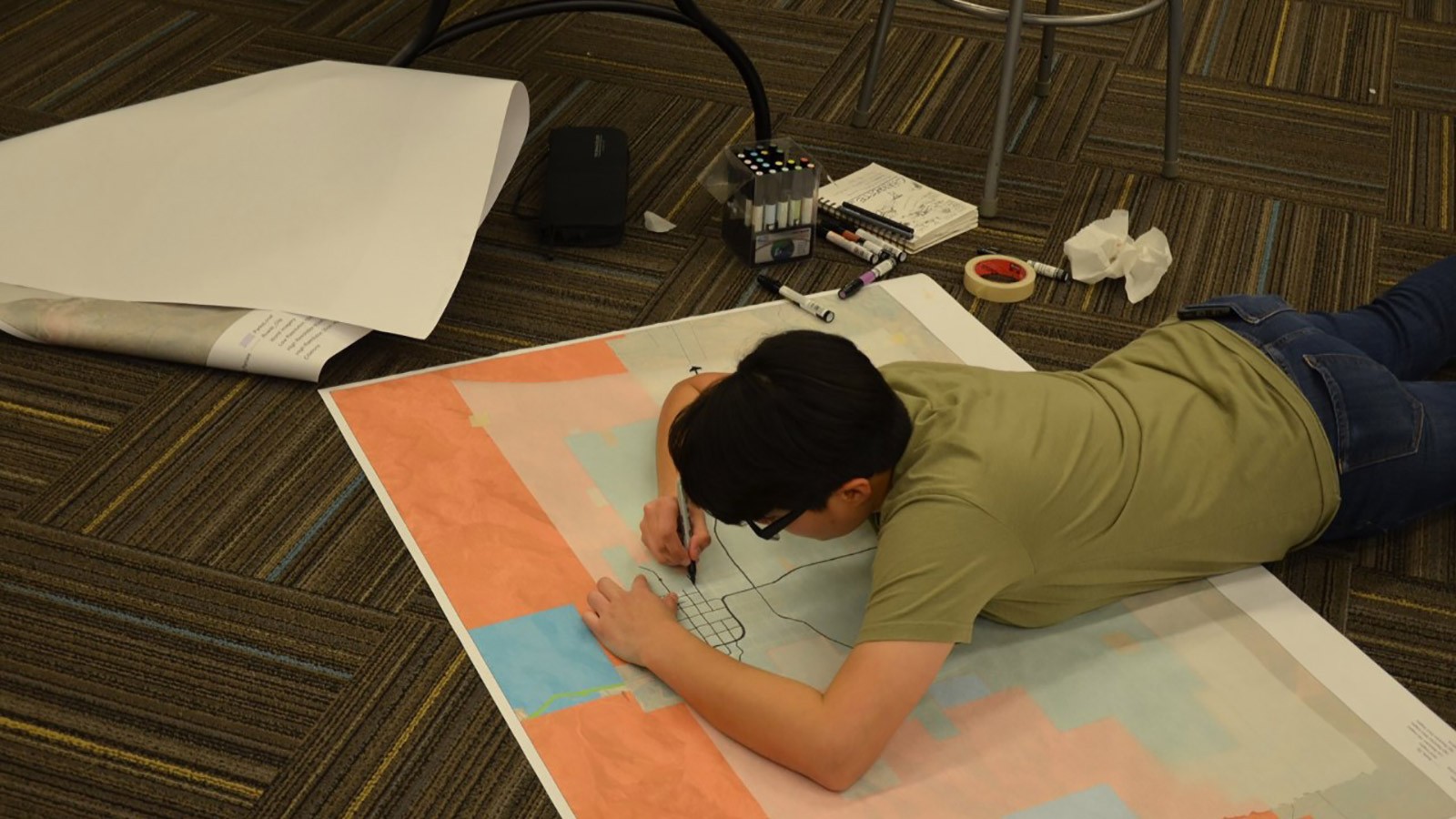 Student Amy Cervantes working on visuals for the design charrette presentation.