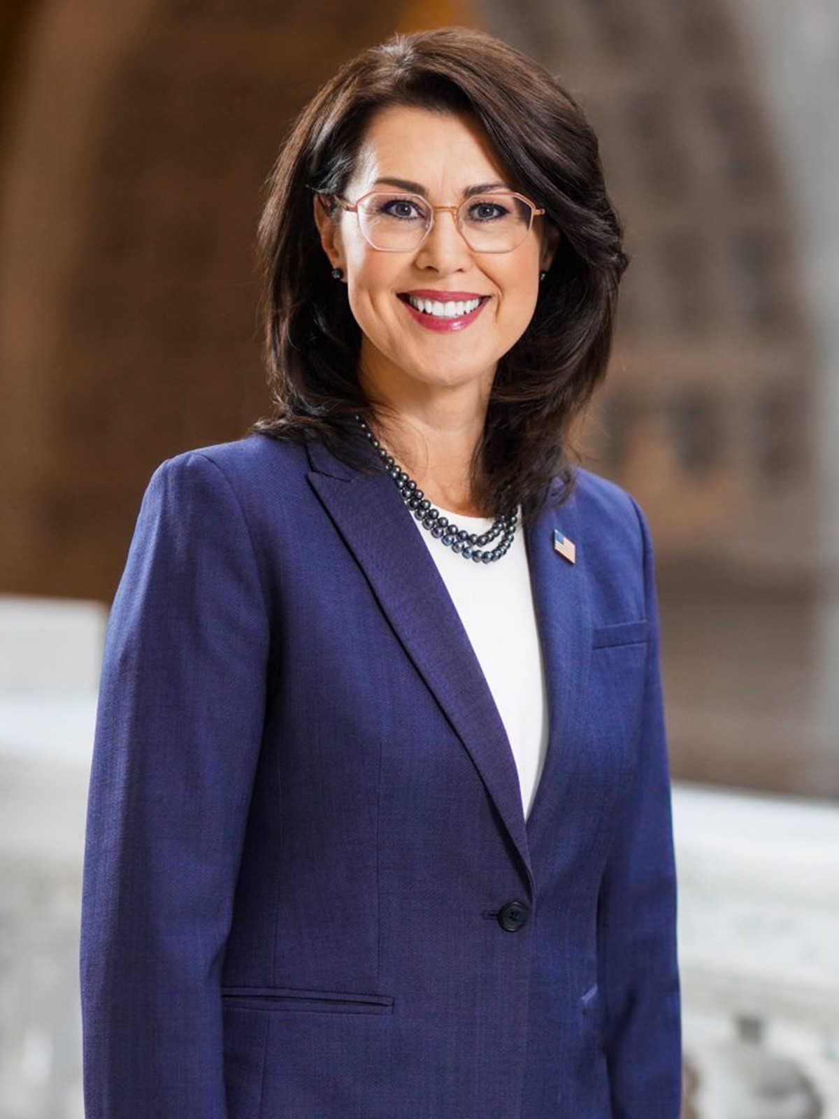 A woman poses for a headshot.