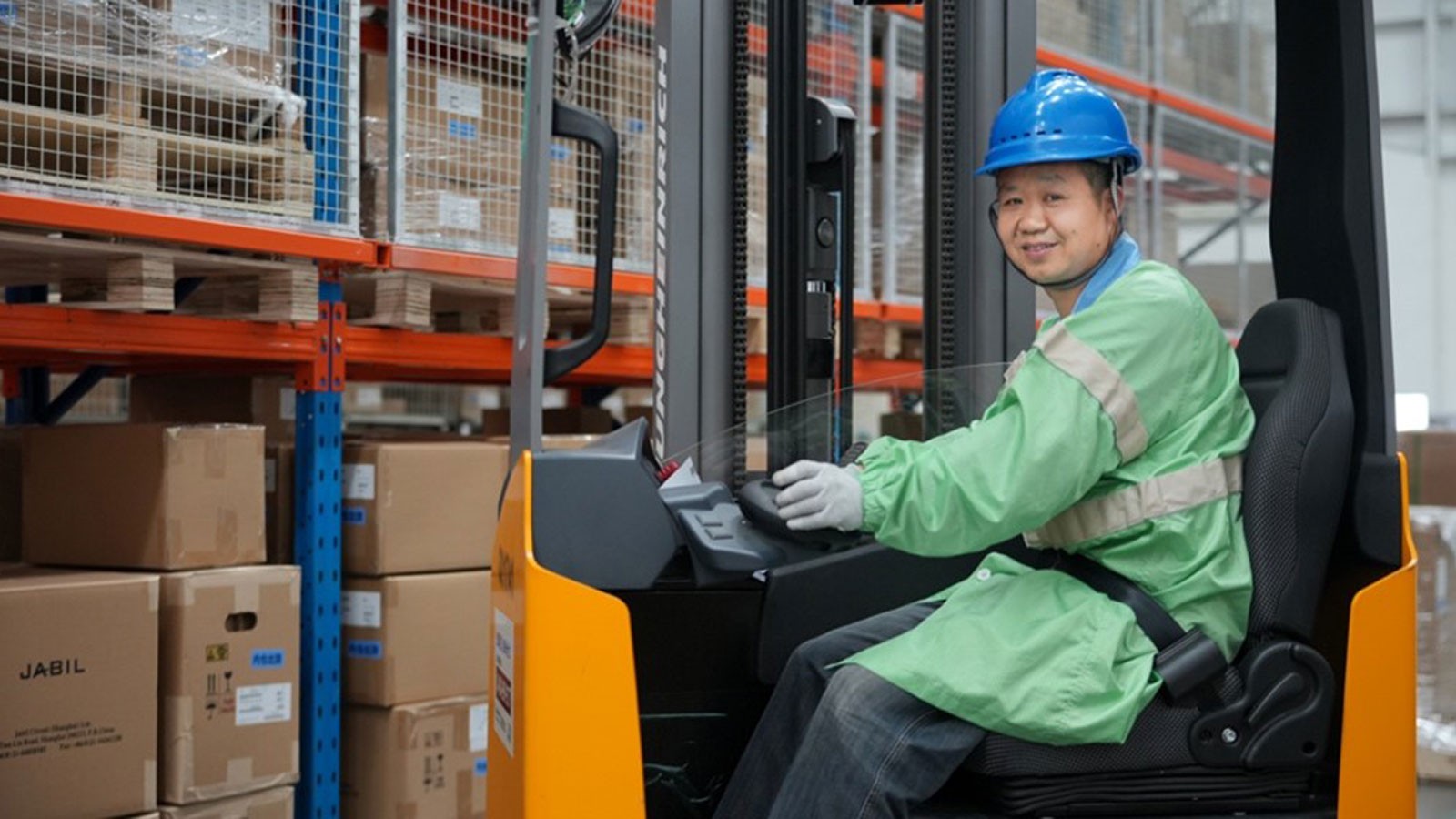 A person operating a forklift.