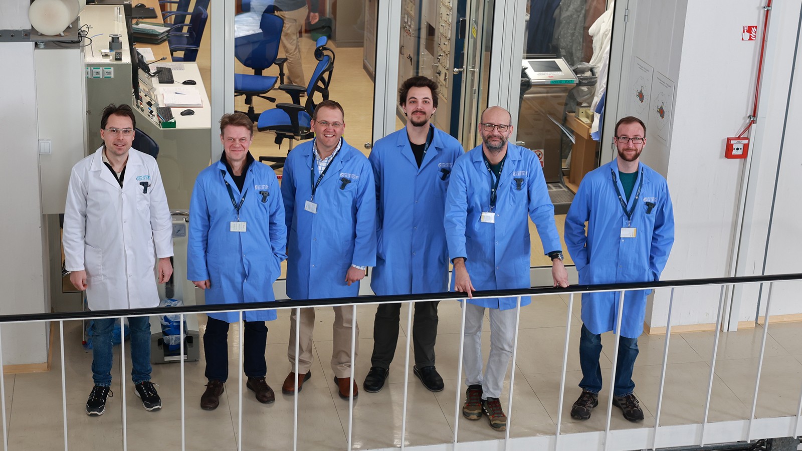 Scientists gather to pose for a photograph