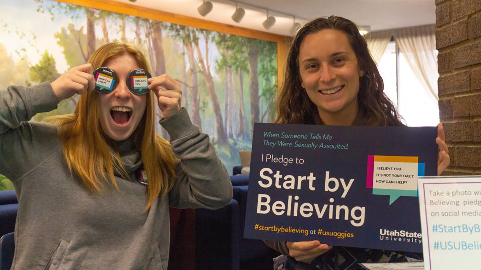 Two SAAVI volunteers hold the
