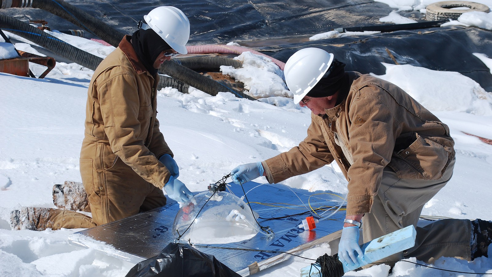 Seth Lyman with a colleague in the field.