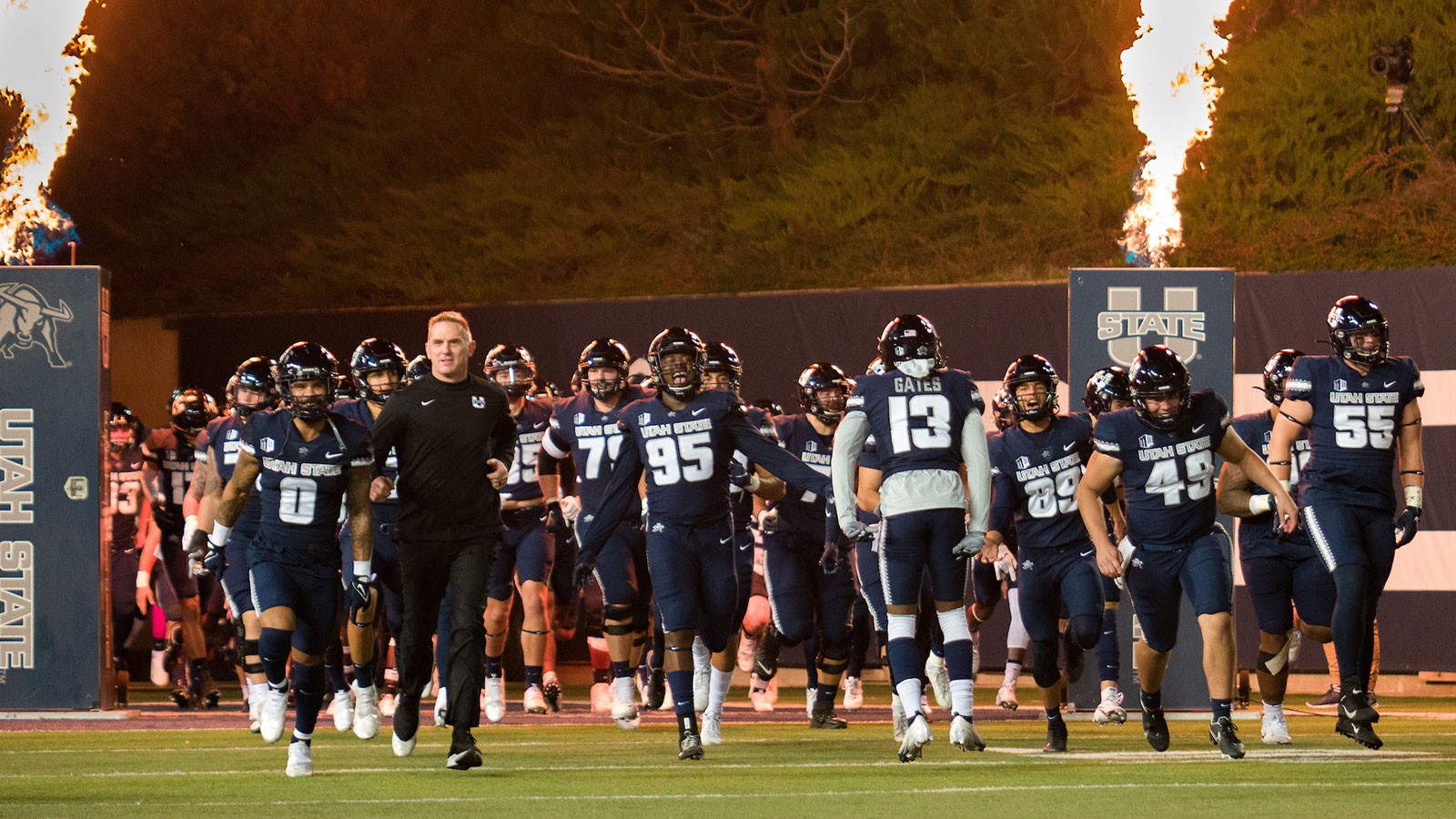 The USU football team takes the field during a game at Colorado State University on Oct. 22.