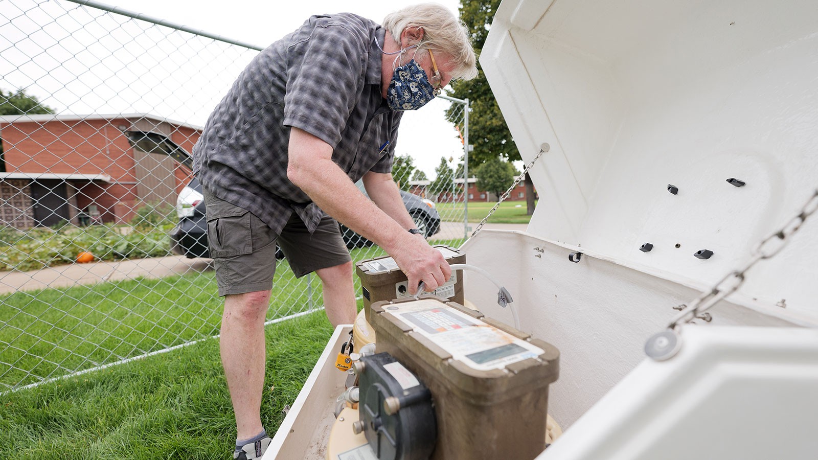 Professor Ryan Dupont sets up waste water collection apparatus
