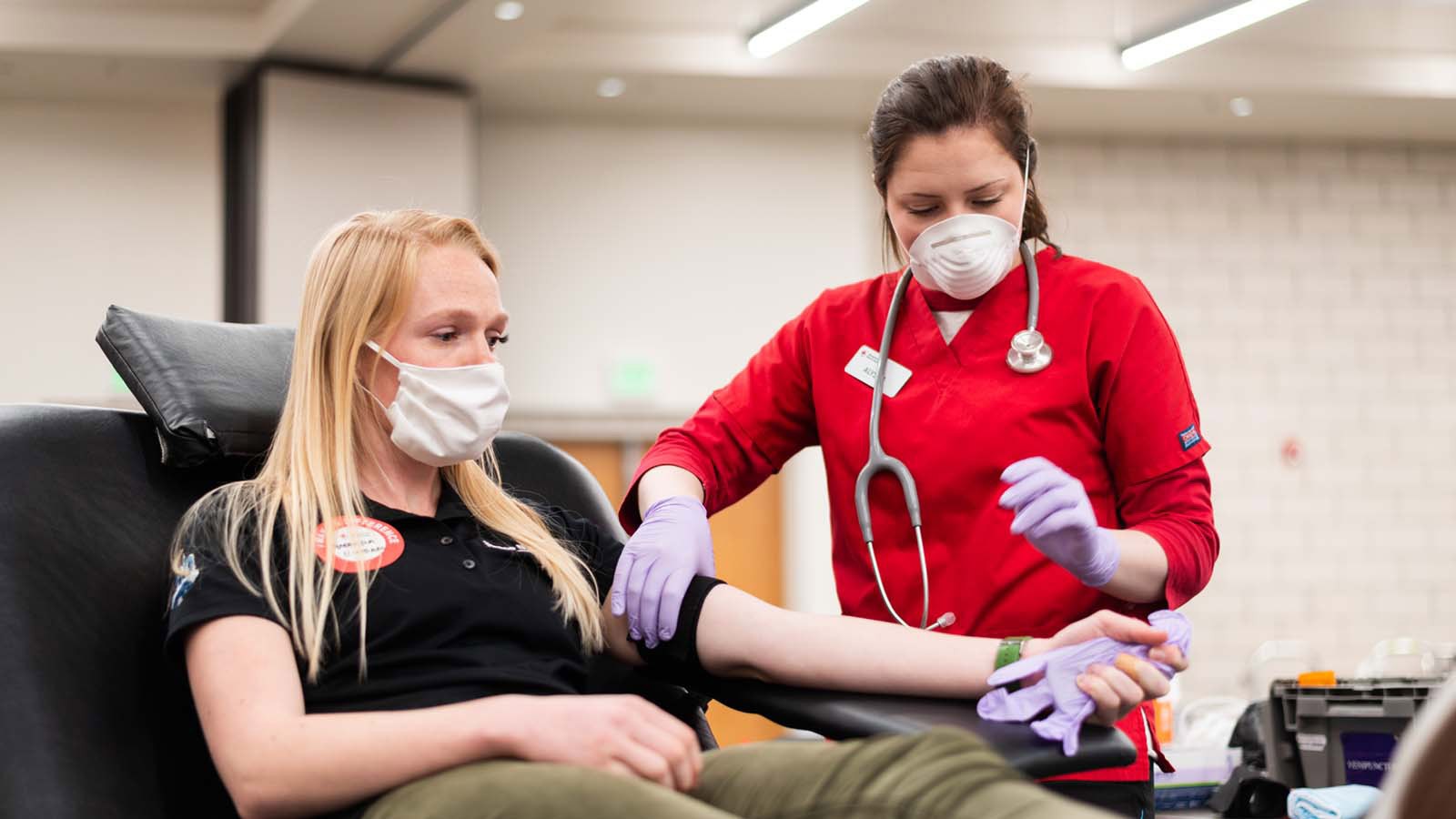 SDL employee Amanda Hansen with phlebotomist Alyssa Crabtree.