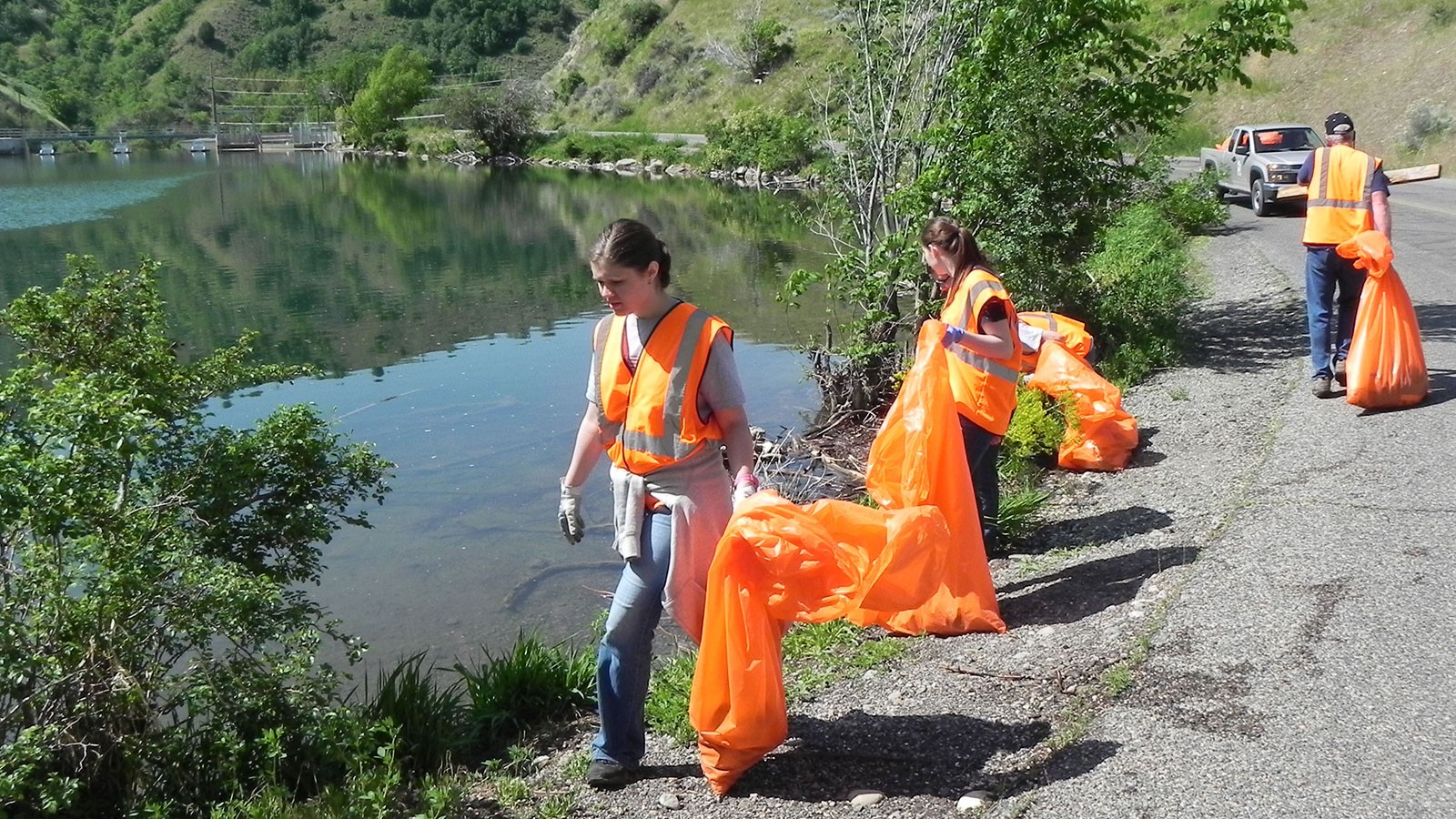Volunteers pick up trash at Logan's First Dam.