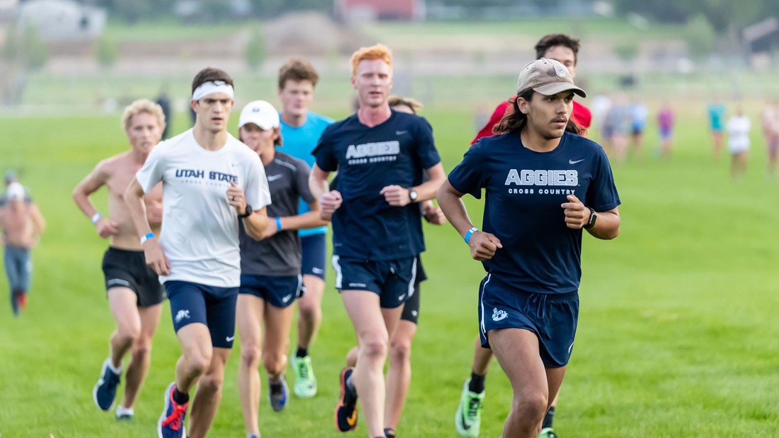 USU distance runners compete on the field.