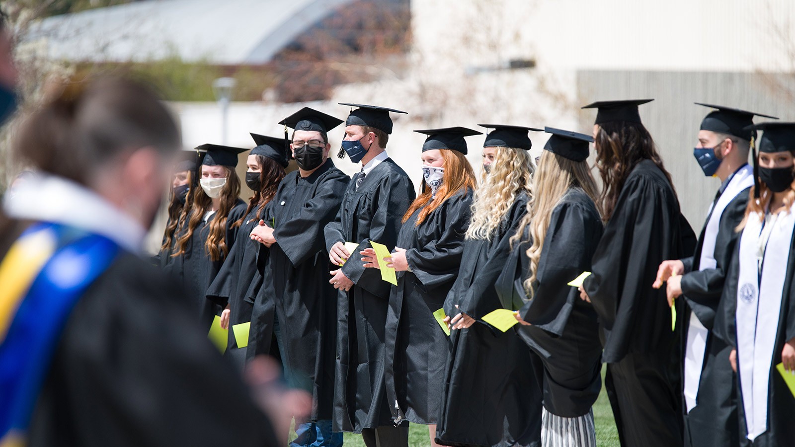 Class of 2021 Graduates at USU Eastern line up during the procession of the commencement ceremonies.