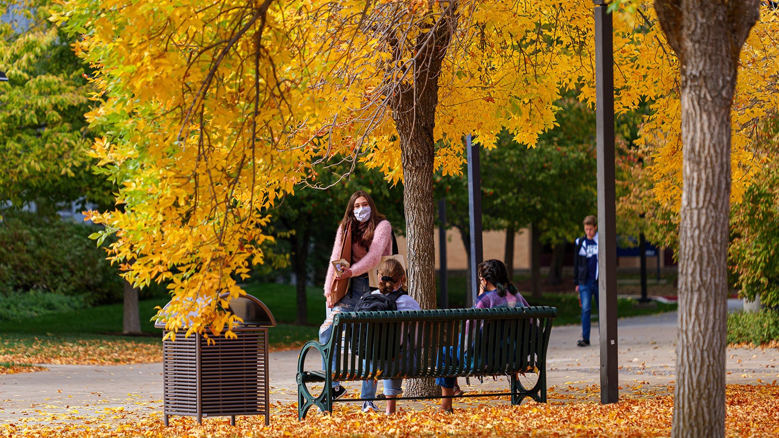 USU students walk on campus in fall.