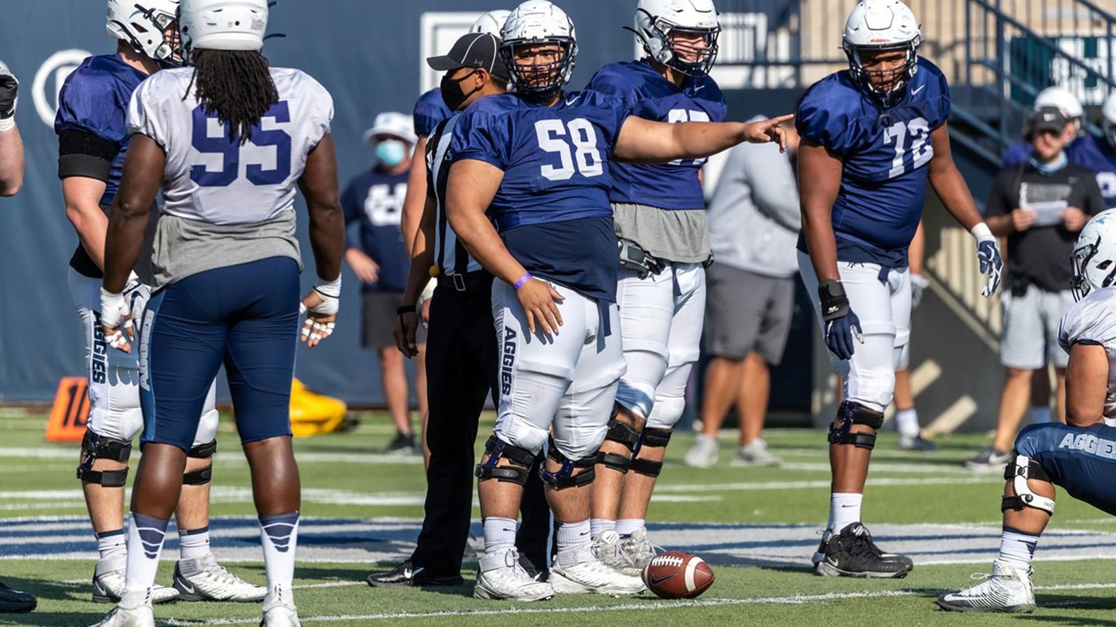 USU football players on the field.