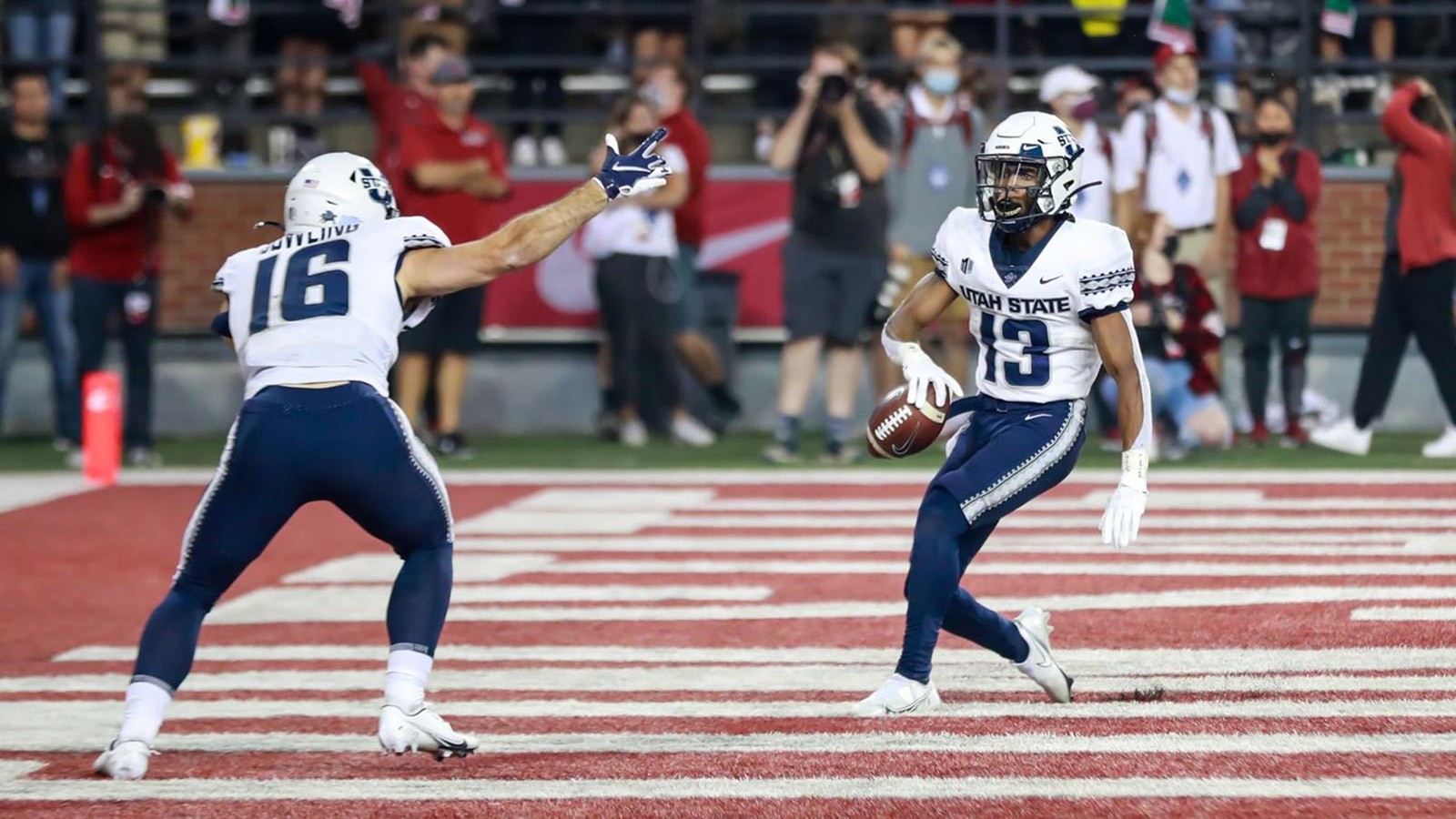 USU football players on the field.