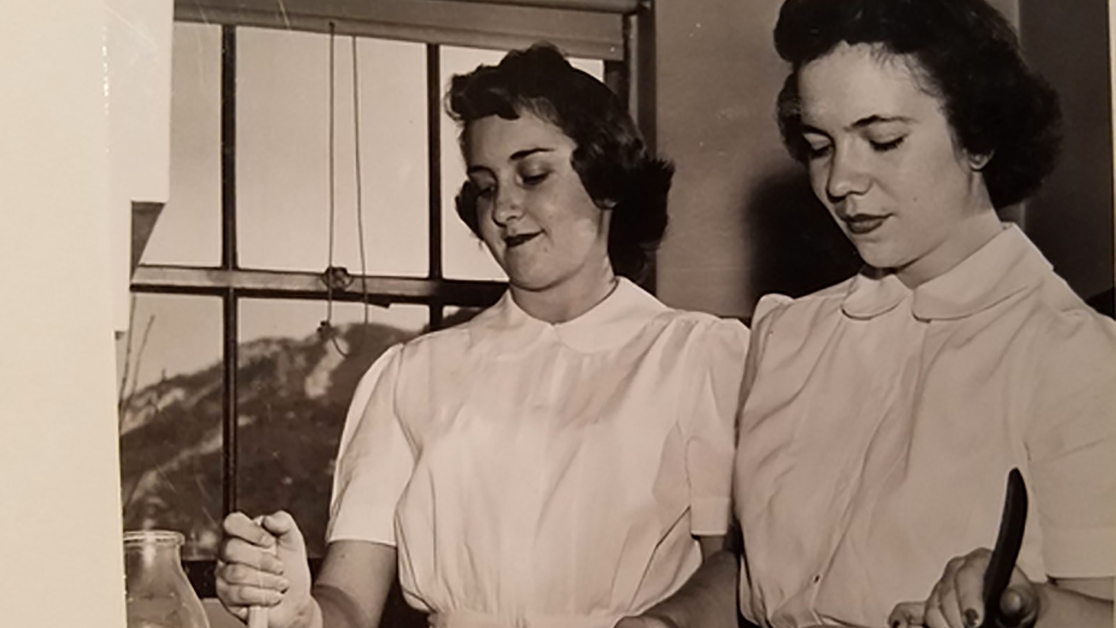 Helen Lower Simmons bakes with a friend in this undated photo.
