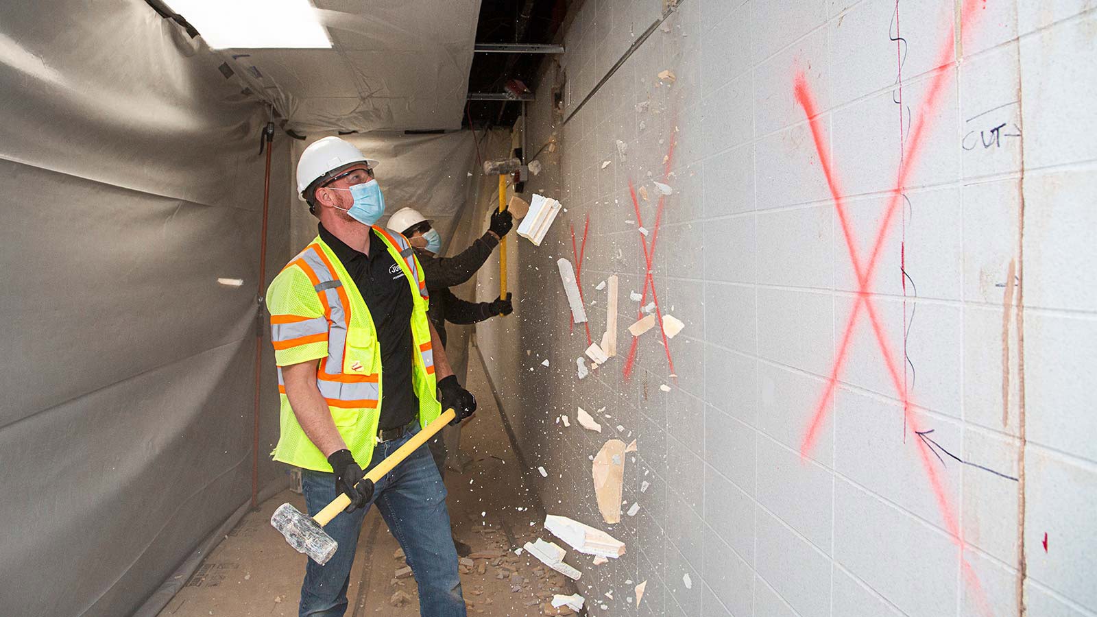 USU alum and J-U-B project engineer Colton Smith participates in the Mar. 25 demolition.