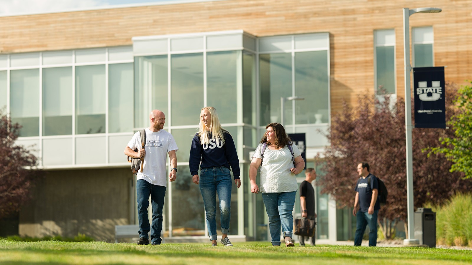 USU students walk on campus.