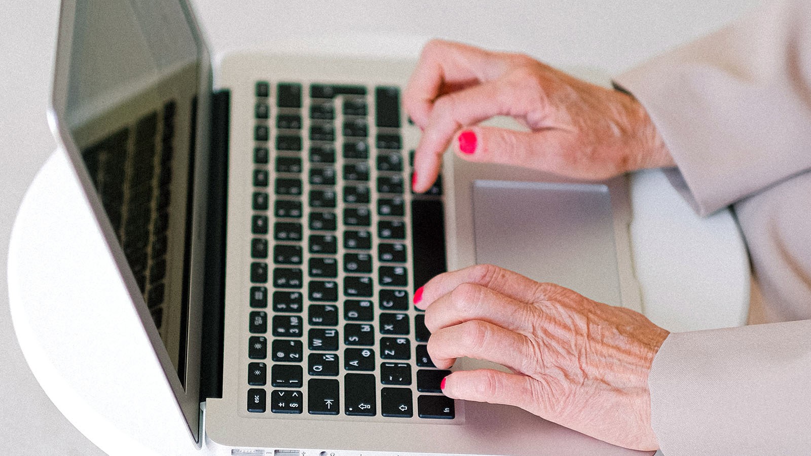 Senior citizen using a computer.
