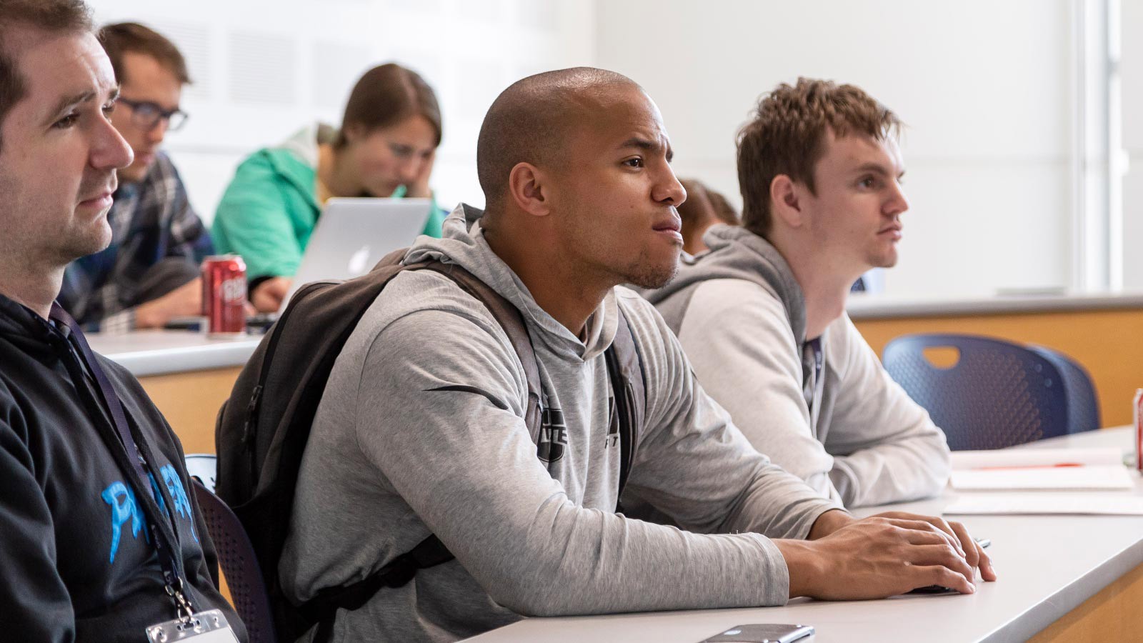students sitting in a classroom.