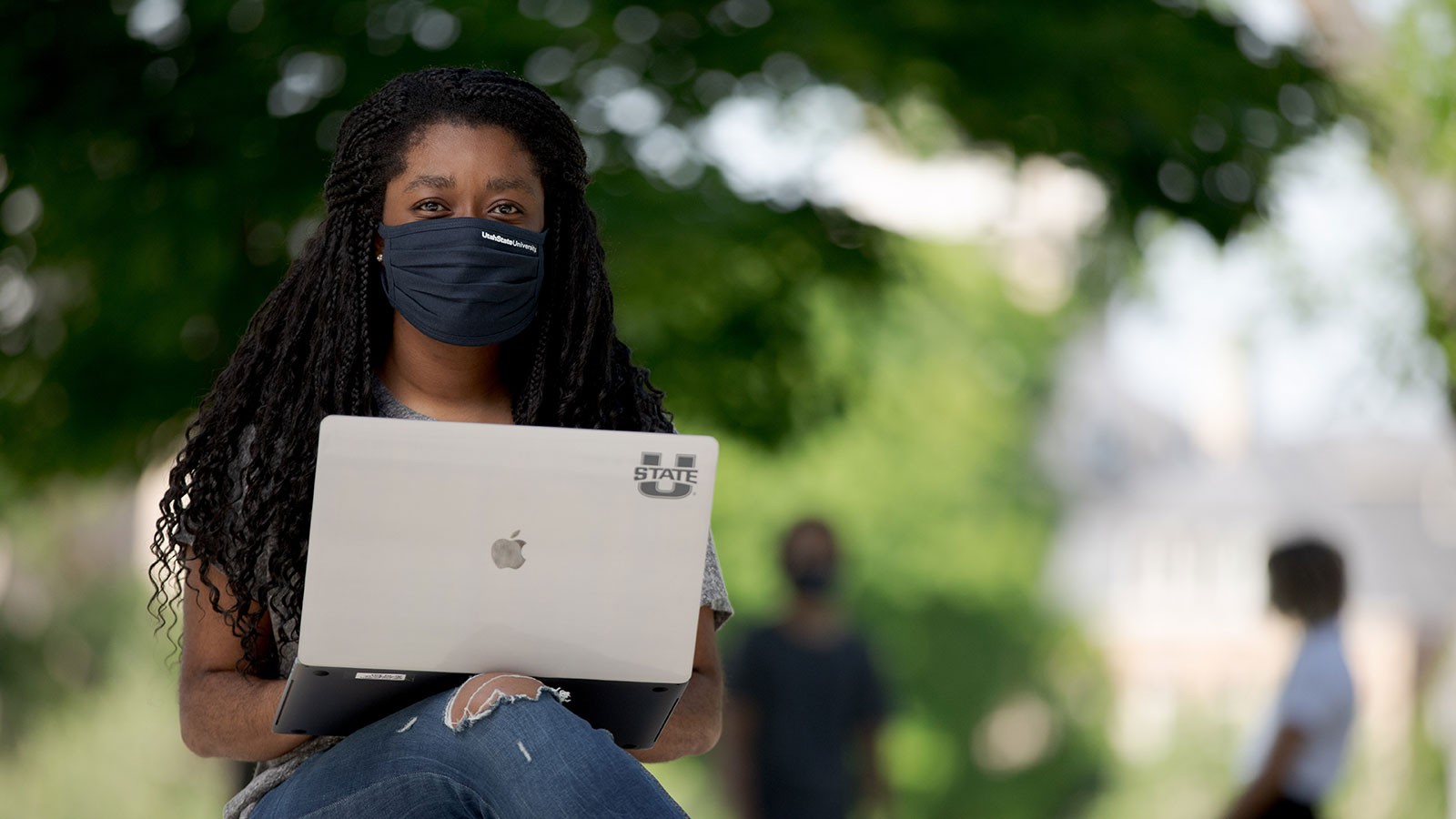 USU student working on a laptop.