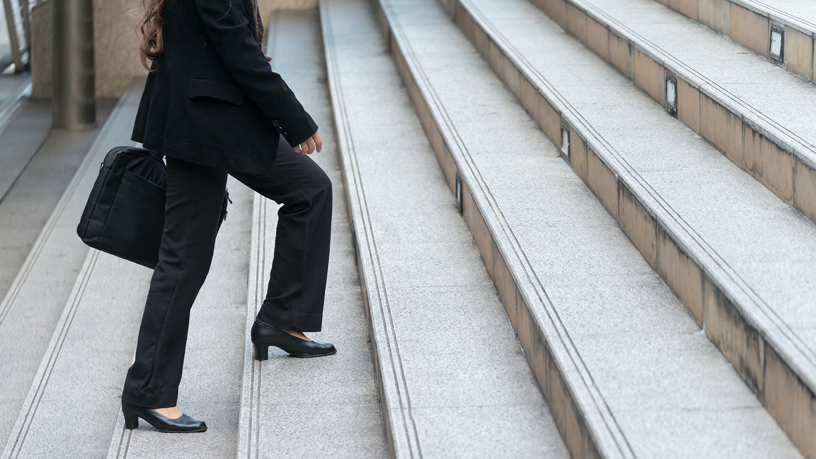 woman climbing stairs