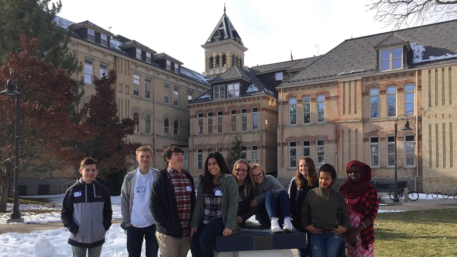 students gathered around the Block A under Old Main