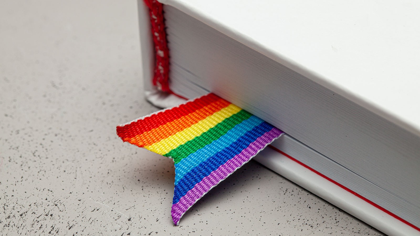 book with rainbow flag bookmark.