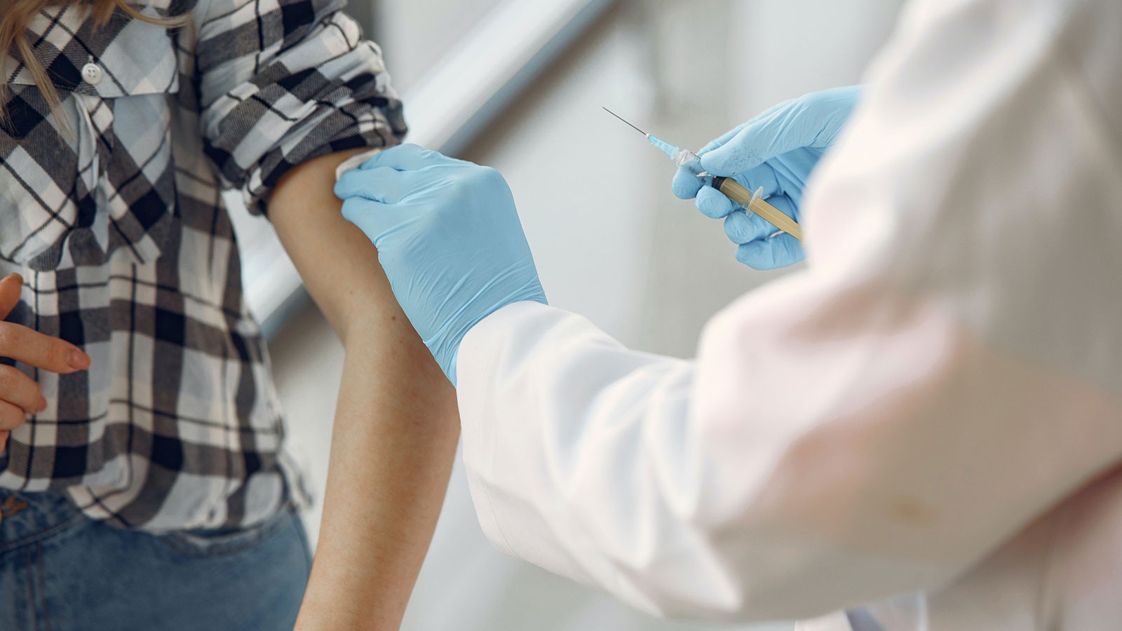 Person getting inoculated.