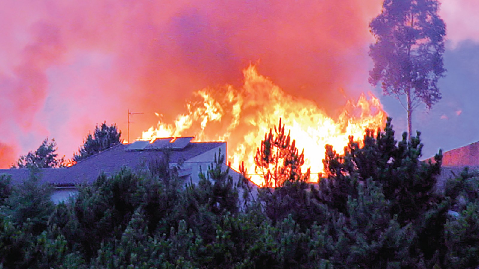 Wildfire near a home.